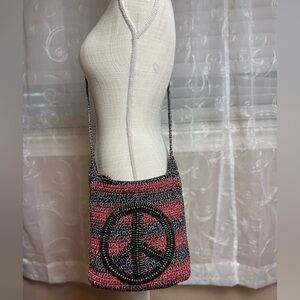 The Sak Wood Peace Sign Crochet Crossbody Bag